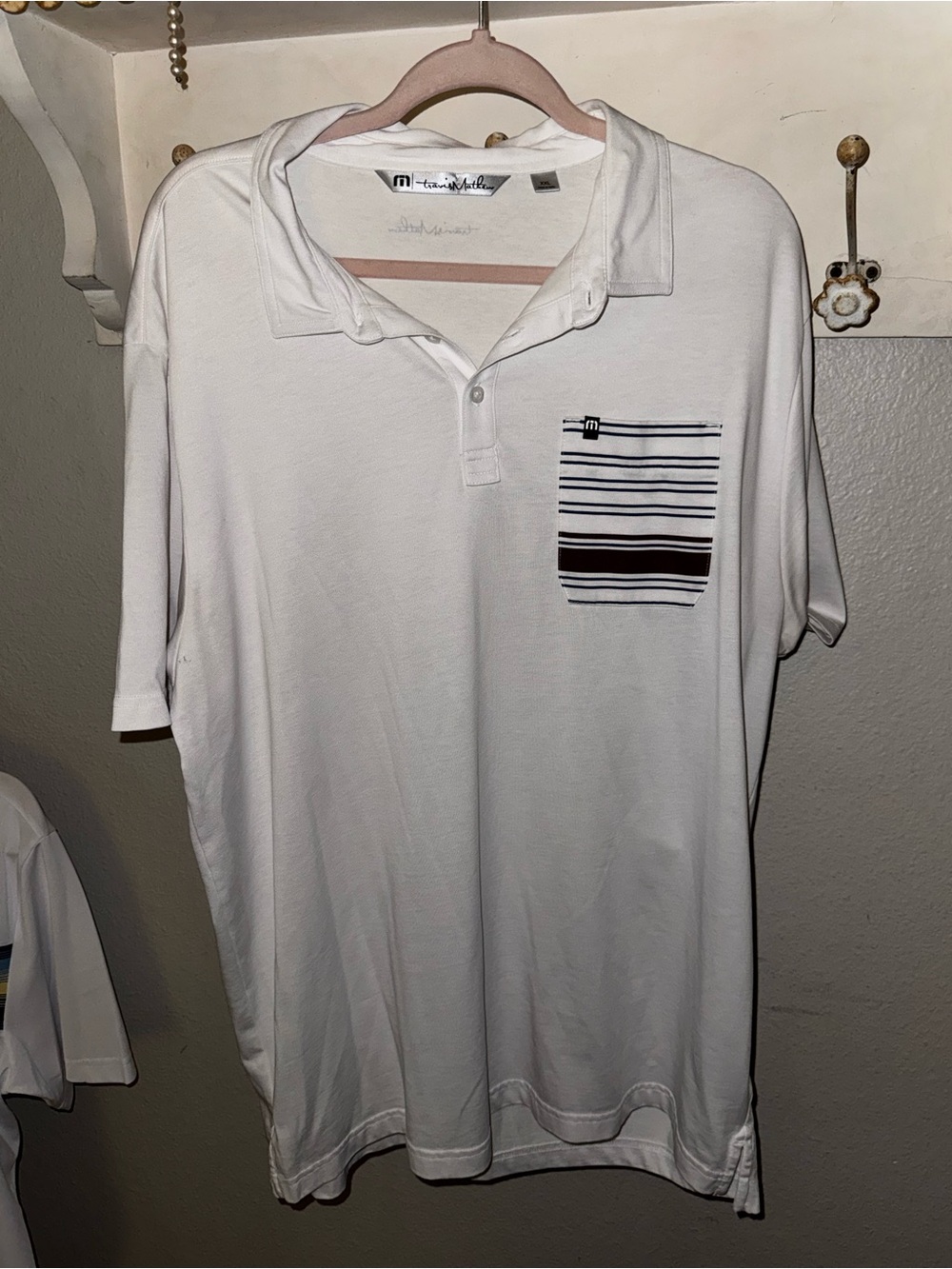 Travis Mathew White Polo with Striped Chest Pocket